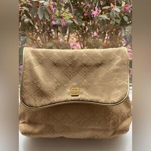 vintage Givenchy Organza gold cosmetic pouch featuring a monogram pattern.